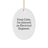 Funny Electrical Engineer Gifts from Friends - Keep Calm I'm (almost) An Electrical Engineer Oval Ornament for Christmas - Image 1